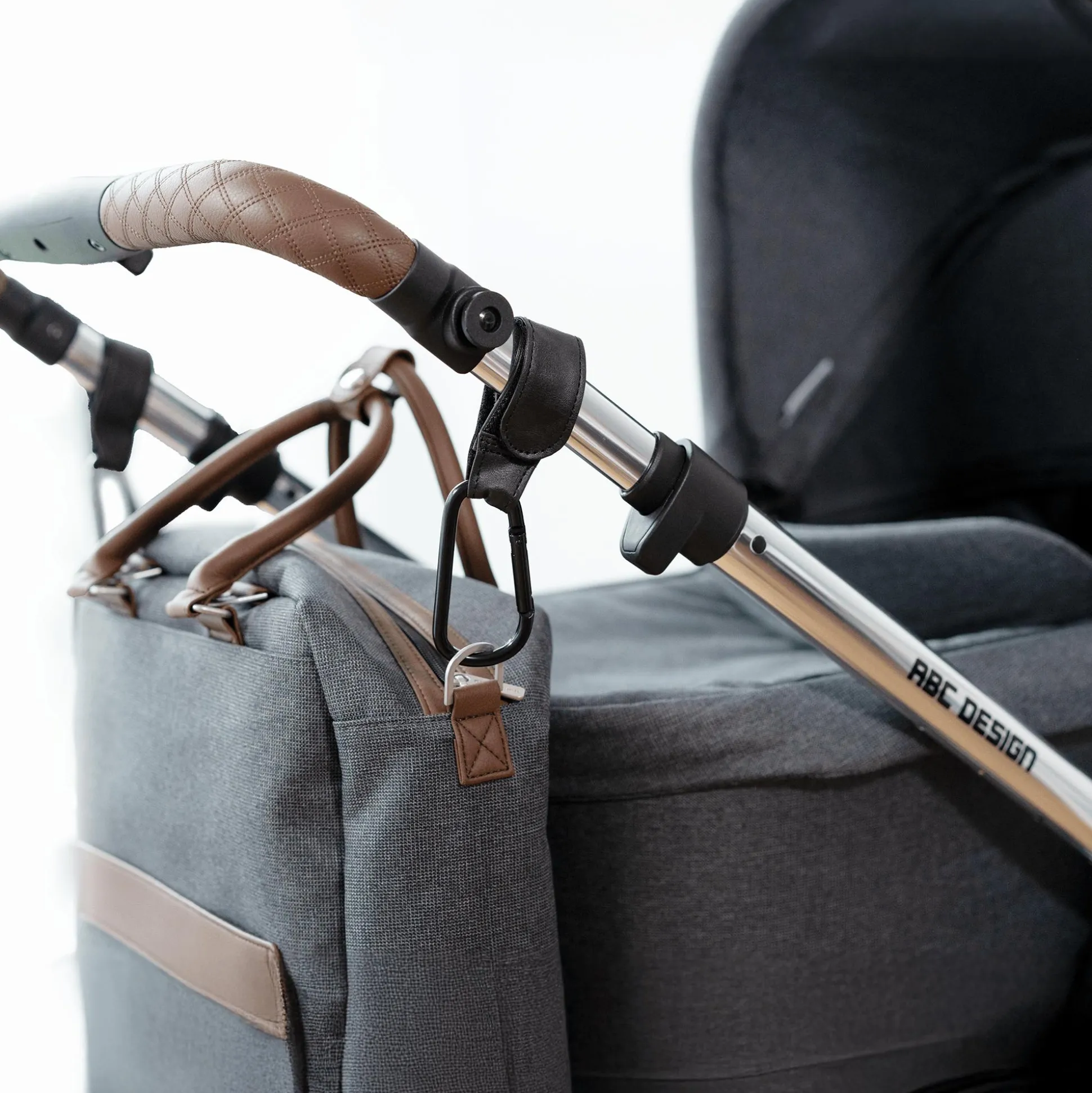 Karabinerhaken für den Kinderwagen